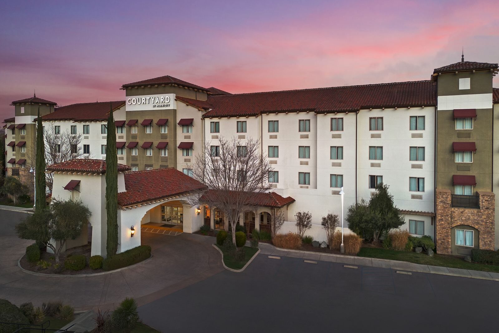 Courtyard by Marriott Paso Robles exterior beneath a pink evening sky